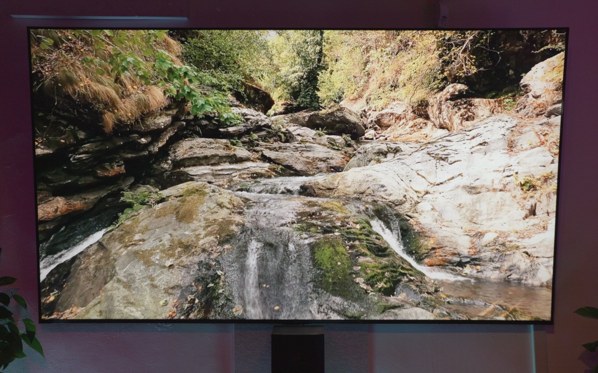98-inch screen showing a river gorge